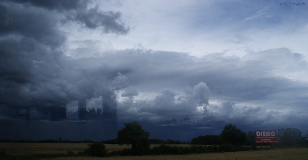 sky behind a bus window